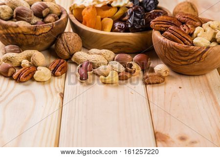 Selection of dried fruits and nuts as symbols of Tu Bishvat, copy space