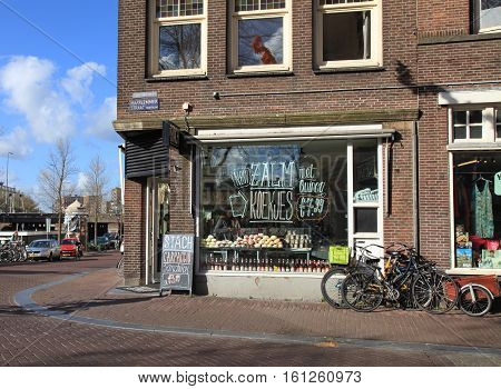 AMSTERDAM, NETHERLANDS - MAY 3, 2016: Cityview with modern Stach cafe window on Haarlem street in Amsterdam, Netherlands.