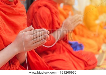 Buddhist Monks Chanting Or Praying In Temple Thailand