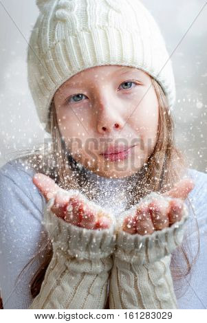 Happy Girl In Winter Clothes Blowing On Palms Winter Happiness And Carefree .