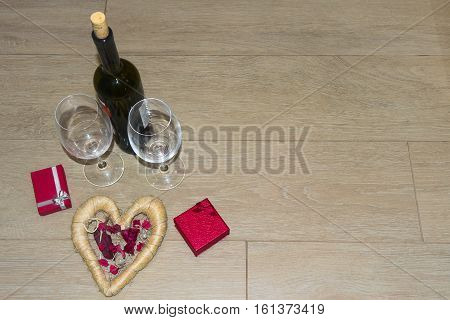 Background for Valentine's Day with heart, gifts, glasses with wine.