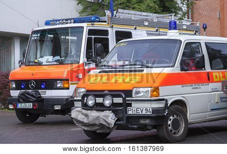 LAUENAU / GERMANY - JULY 13 2013: german DLRG ( German Lifeguard Association ) trucks stands in waiting position for the flood