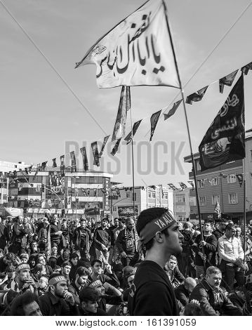 Istanbul Turkey - October 11 2016: Shia Muslim men shout Islamic slogans as they mourn during an Ashura procession. Muslims worldwide marks Ashura Istanbul Shiite community. Turkish Shia Muslims mourning for Imam Hussain. Caferis take part in a mourning p