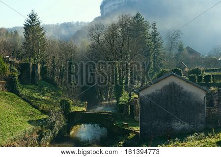Small river runs through the centre of the Baume-les-Messieurs village. Jura department of Franche-Comte. Baume-les-Messieurs is classified as one of the most beautiful villages of France
