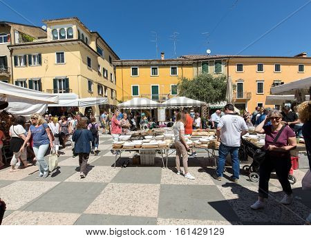 LAZISE ITALY - MAY 4 2016: The open air market in Lazise at Garda Lake. Italy