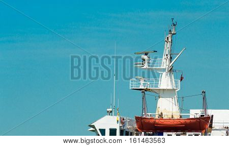 Foretop Of A Passenger Ship And An Orange Lifeboat