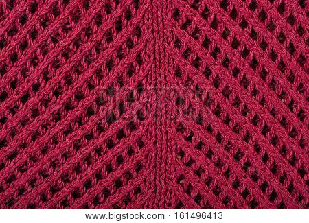 Dark red openwork stockinet as background texture