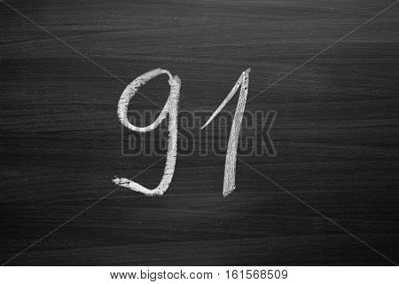number ninety one enumeration written with a chalk on the blackboard