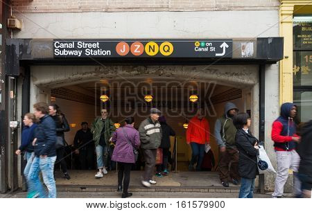 NEW YORK - MAY 2 2016: Unknown people in front of the entrance of Canal Street subway in chinatown Manhattan