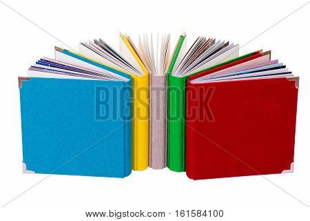 Multicolored book textile cover. Photobooks on a white background