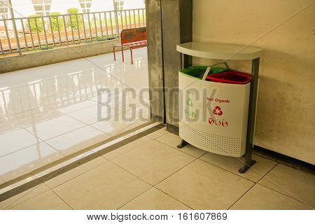trash can or box with organic and non-organic on pondok cina station photo taken in jakarta indonesia
