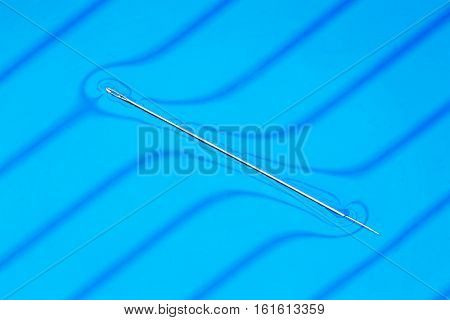 Physical experiment - needle floats on water surface.
