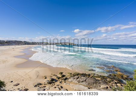 View of the Bondi beach and modern beachside apartments in Sydney, Australia during daytime