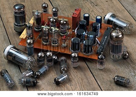 radio lamps and transistors on a wooden table