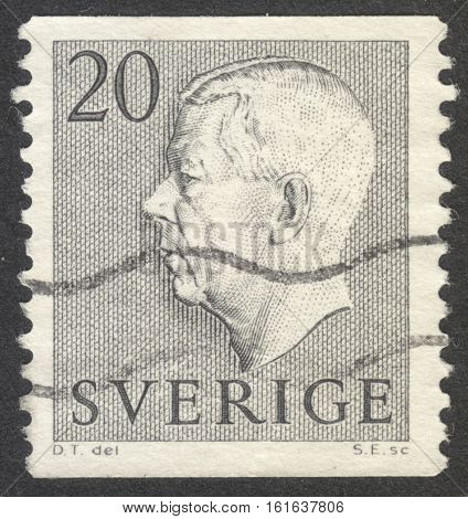 MOSCOW RUSSIA - CIRCA NOVEMBER 2016: a post stamp printed in SWEDEN shows a portrait of King Gustaf VI Adolf the series circa 1952