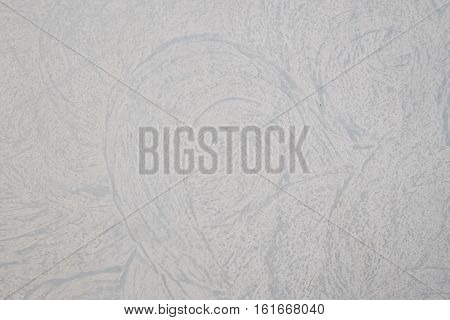 A white textured plaster wall with interesting design