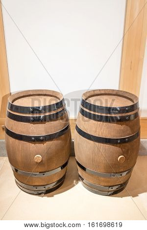 empty wooden barrels on display in a local museum