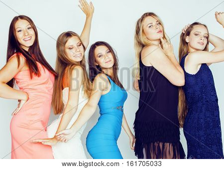group of many cool modern girls friends in bright clothers together having fun isolated on white background, happy smiling lifestyle people concept