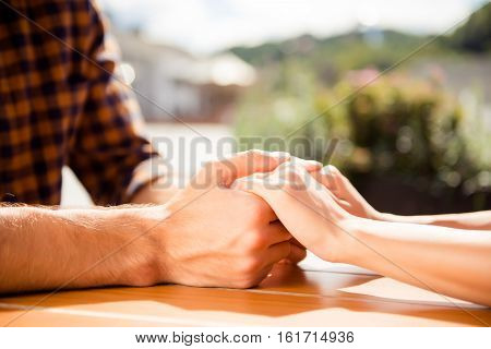 Close Up Of Romantic Couple In Love Holding Each Other Hands