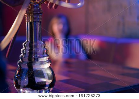 Young Wooman In A Hookah Bar.
