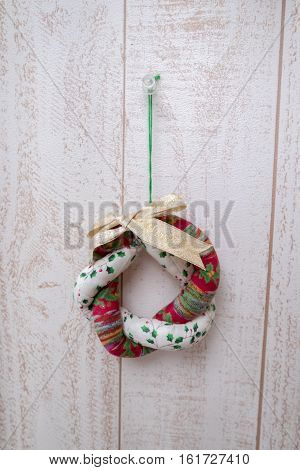 round hanging christmas ornament on a white wall