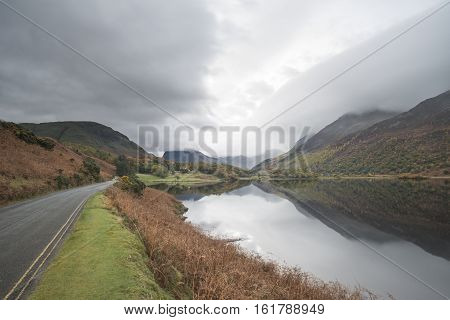 Beautiful Autumn Fall Landscape Image Of Crummock Water At Sunrise In Lake District England