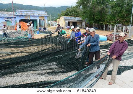 Many Fishermen Working With Fishing Nets