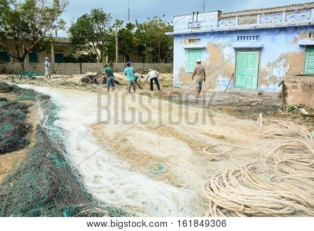 Many Fishermen Working With Fishing Nets