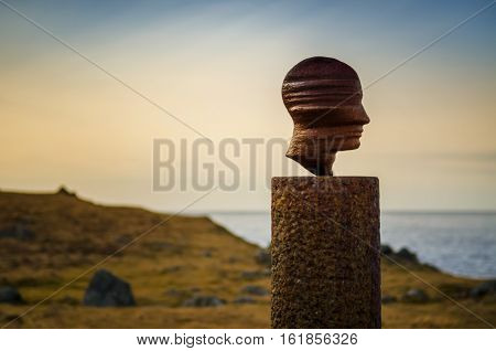 Head sculpture on Eggum coastline Lofoten, Norway
