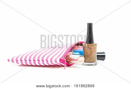 Make up bag with Nail polish on white background
