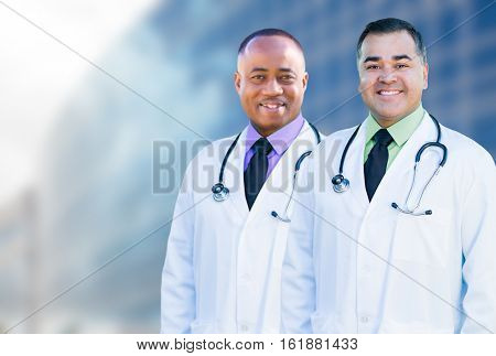 Handsome African American and Hispanic Male Doctors Outside of Hospital Building.