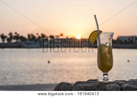 Amazing Sunset glass cocktail in Sultanate Oman at Souly Bay harbour and Hotels Oceanside