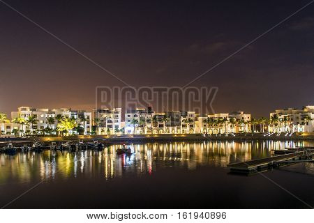 Amazing night lights in Sultanate Oman Souly Bay harbour and Hotels Oceanside 