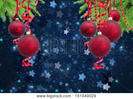 Red christmas balls garlands and evergreen fir tree on blue winter background