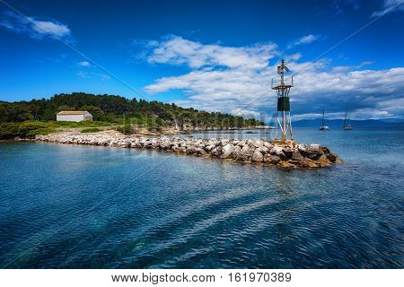 The Island of Paxos, Greece, 22 May, 2016: Early summer of the Island of Paxos - The Port of the Island of Paxos with buildings and boats around it.