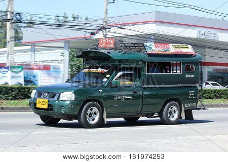 CHIANG MAI THAILAND - OCTOBER 31 2016: Green mini truck taxi chiangmai Service between city and Sansai district. Photo at road no.1001 about 8 km from downtown Chiangmai thailand.