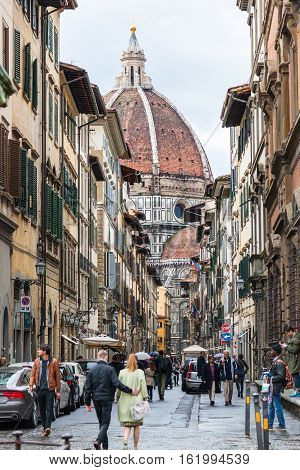 People And View Of Duomo Trough Via Dei Servi