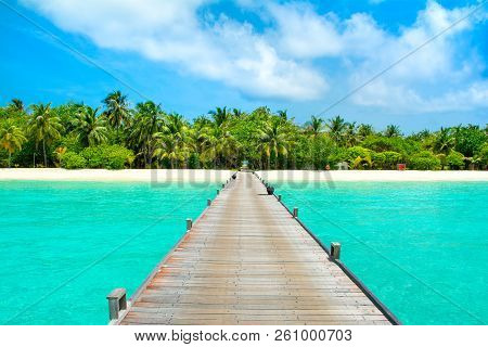 Beautiful Landscape Of Over Water Wooden Bridge To Sandy Beach With Palms And Tropical Plants, Maldi