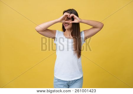 Healthy Eyes And Vision. Portrait Of Beautiful Happy Woman Holding Heart Shaped Hands Near Eyes. Clo