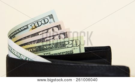 Amarican Dollars Are Partially Visible With A Purse2