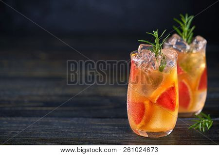 Two Grapefruit Cocktails On A Black Background