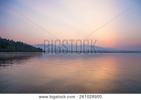 A Dreamy, Hazy Landscape Of A Mountains Close To Sunset. Sun Flase And Misty Look In Blue Tones. Mo