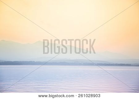 A Dreamy, Hazy Landscape Of A Mountains Close To Sunset. Sun Flase And Misty Look In Blue Tones. Mo