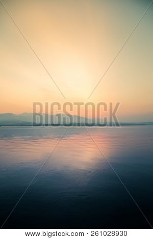 A Dreamy, Hazy Landscape Of A Mountains Close To Sunset. Sun Flase And Misty Look In Blue Tones. Mo