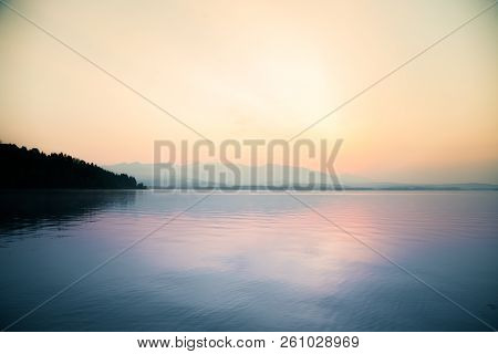 A Dreamy, Hazy Landscape Of A Mountains Close To Sunset. Sun Flase And Misty Look In Blue Tones. Mo