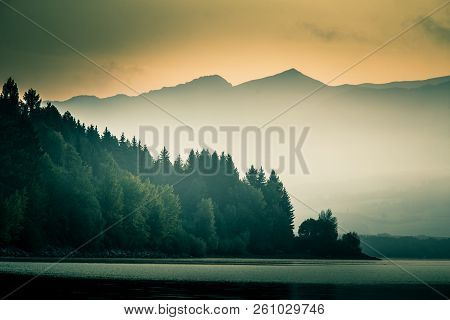 A Beautiful, Calm Morning Landscape Of Lake And Mountains In The Distance. Colorful Summer Scenery W