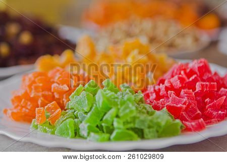 Bright Colorful Sweet Candied Fruit Ingredients On Ceramic White Plate