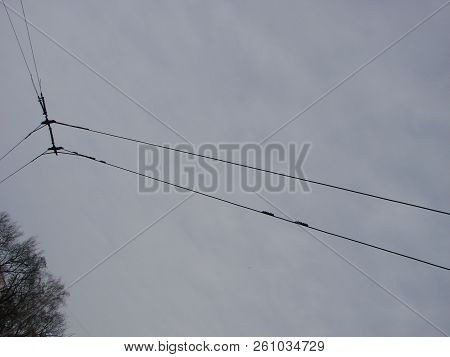 Wires Pole With Blue Sky. Electrical Wires On A Background. Electric Cables. Power Cable With Blue S
