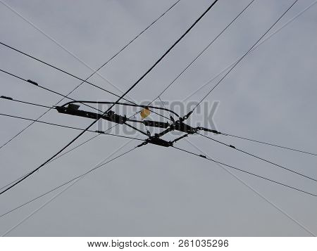 Wires Pole With Blue Sky. Electrical Wires On A Background. Electric Cables. Power Cable With Blue S