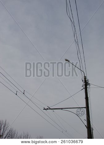 Wires Pole With Blue Sky. Electrical Wires On A Background. Electric Cables. Power Cable With Blue S